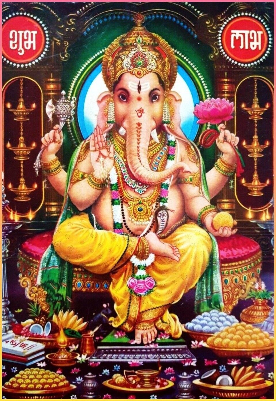 Golden Ganesha with lotus and modak.