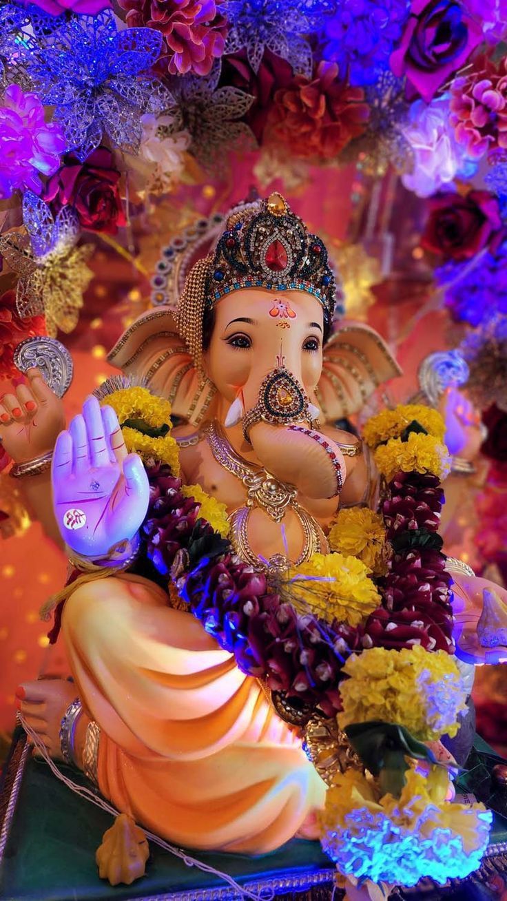Lord Ganesha with flowers and gold