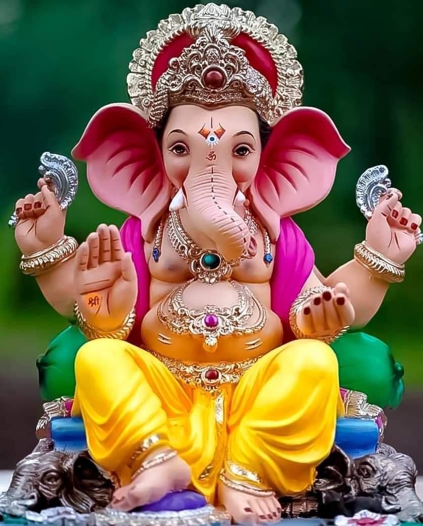 Lord Ganesha statue with golden ornaments