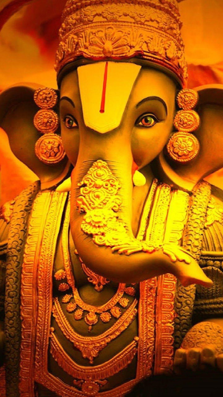 Close-up of golden Ganesha idol