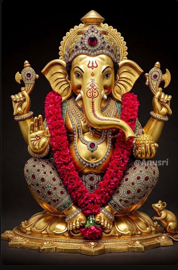 Lord Ganesha golden statue with mouse