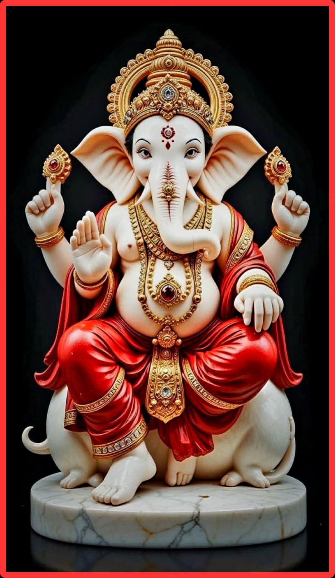 Golden Ganesha statue with mouse