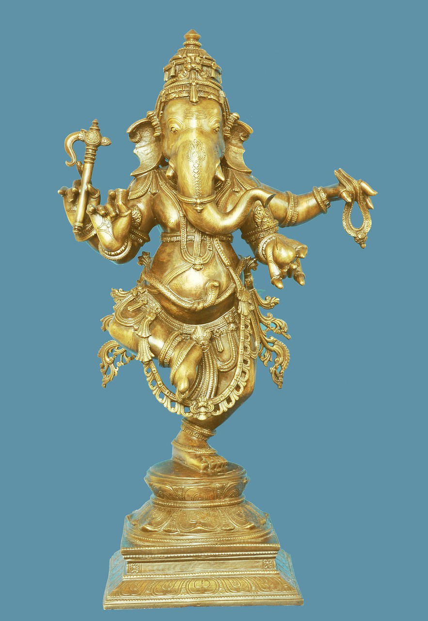 Golden Ganesha statue with blessings