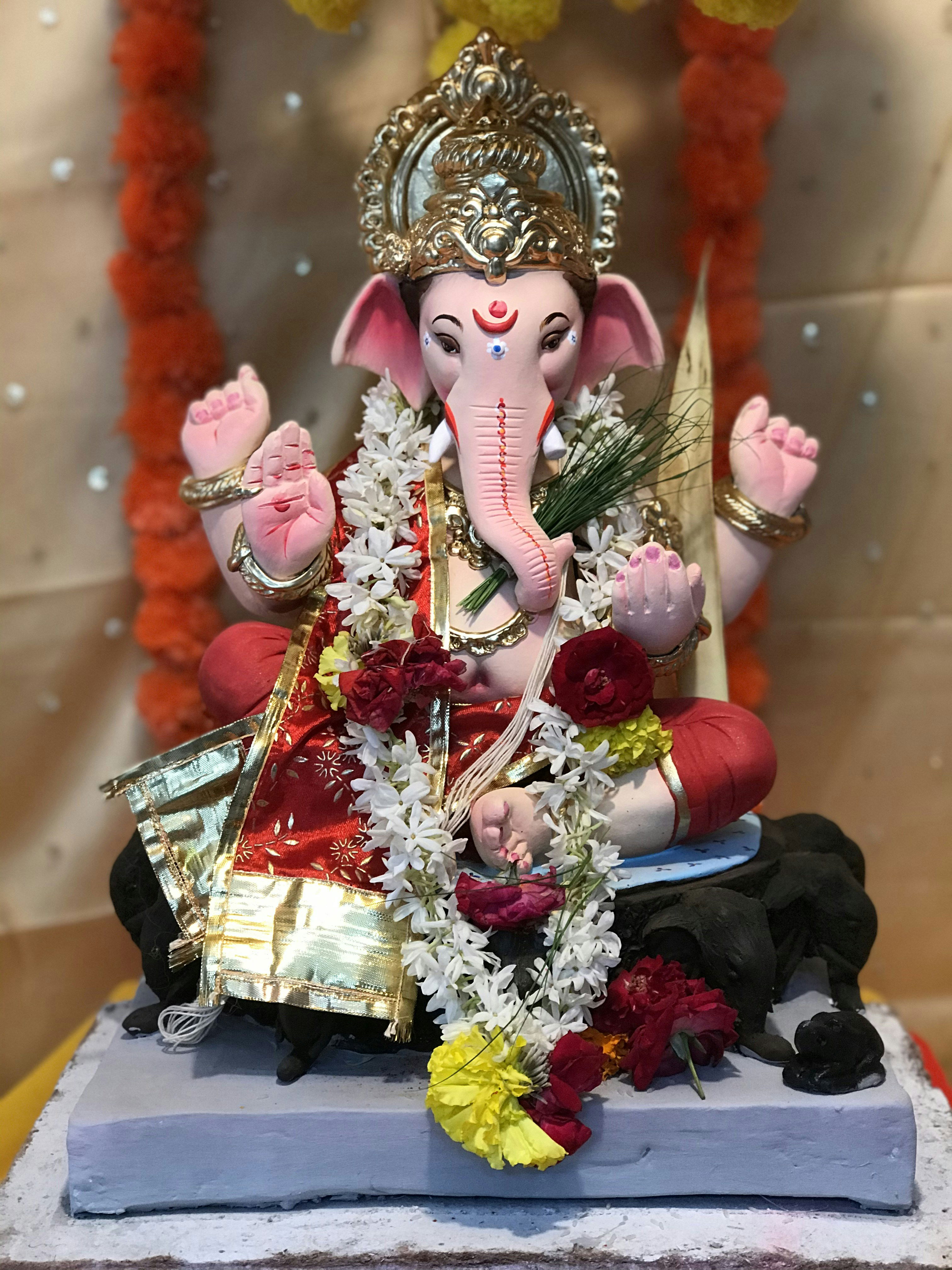 Lord Ganesha with flower garland.