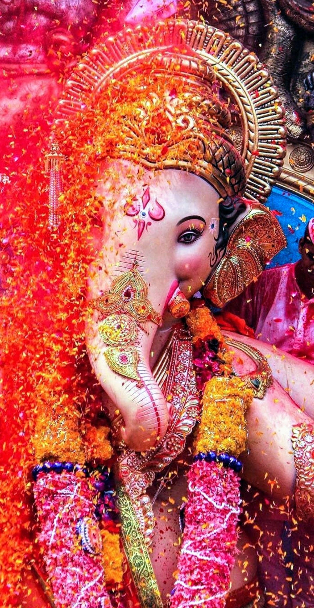 Ganesha adorned with orange marigolds