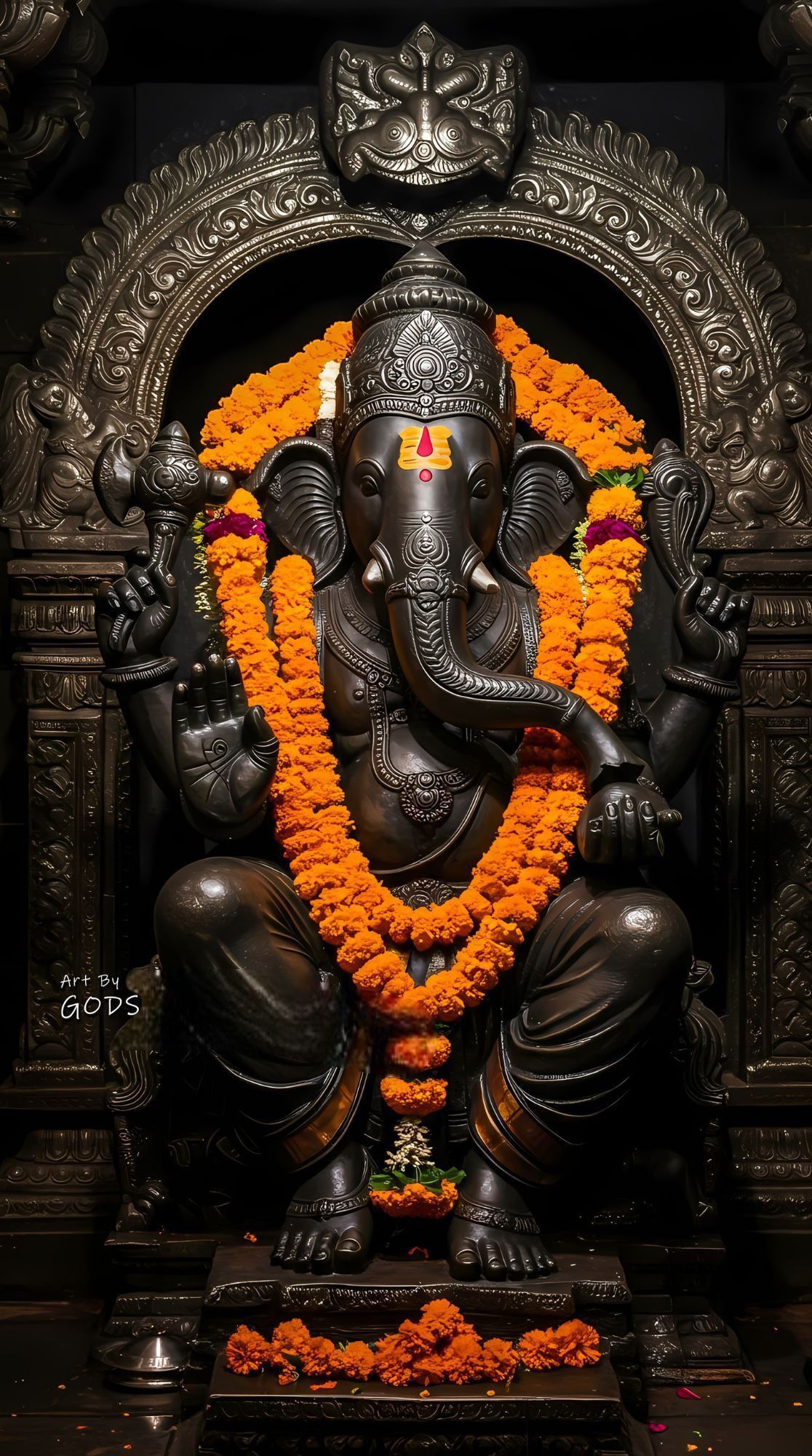 Lord Ganesha statue with marigold flowers.