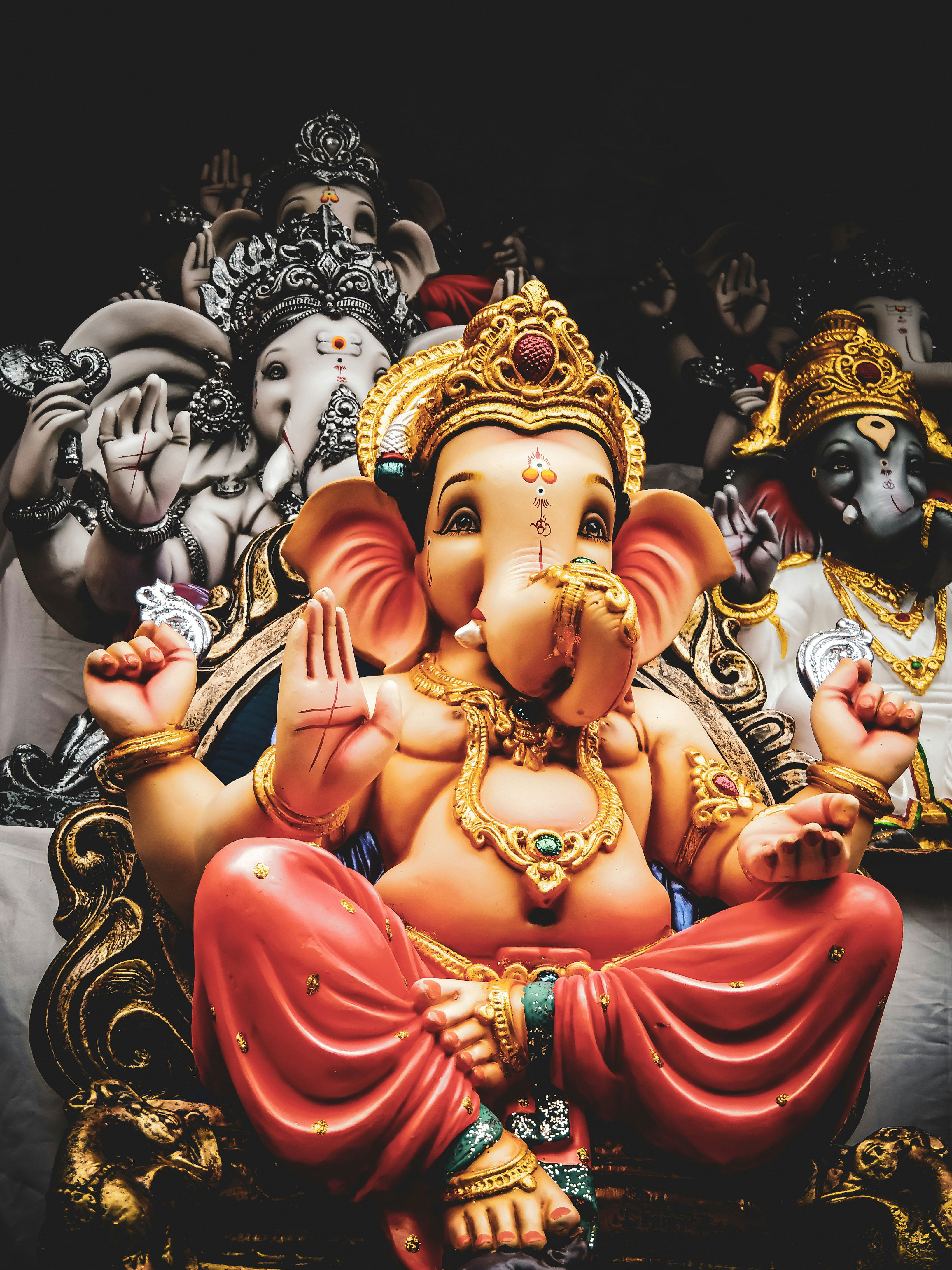 Golden Ganesha statue with blessings