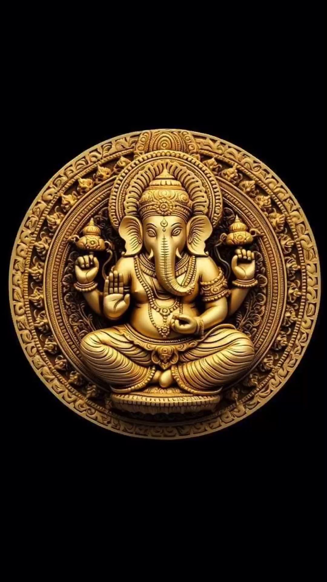 Golden Ganesha idol in ornate frame