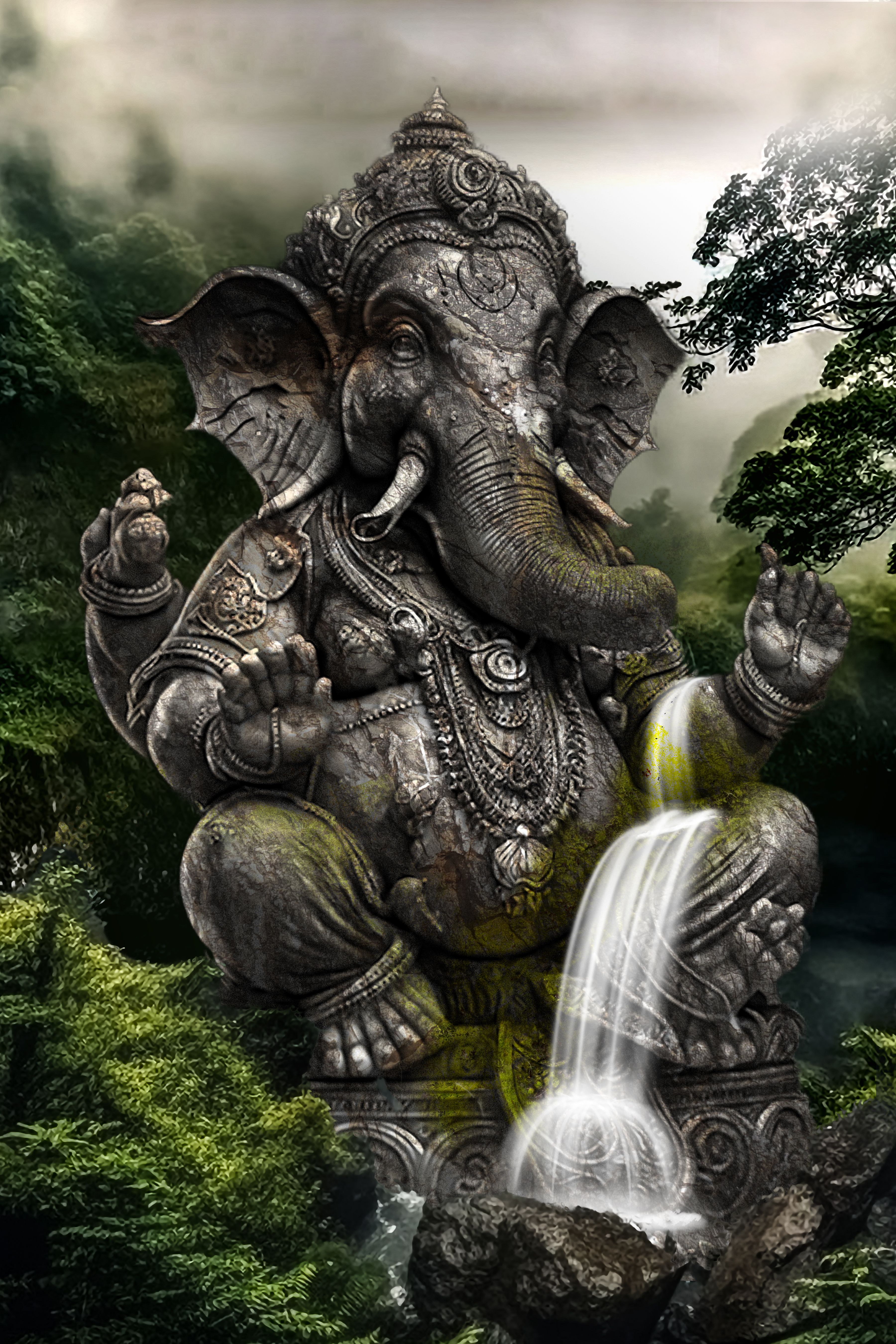 Stone Ganesha amidst waterfall and forest.