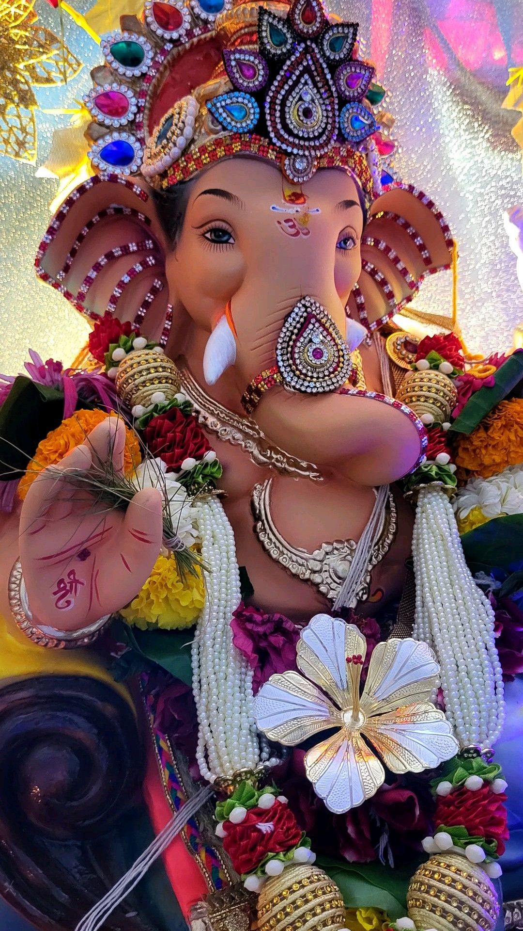 Ganesha with jewels and floral garland
