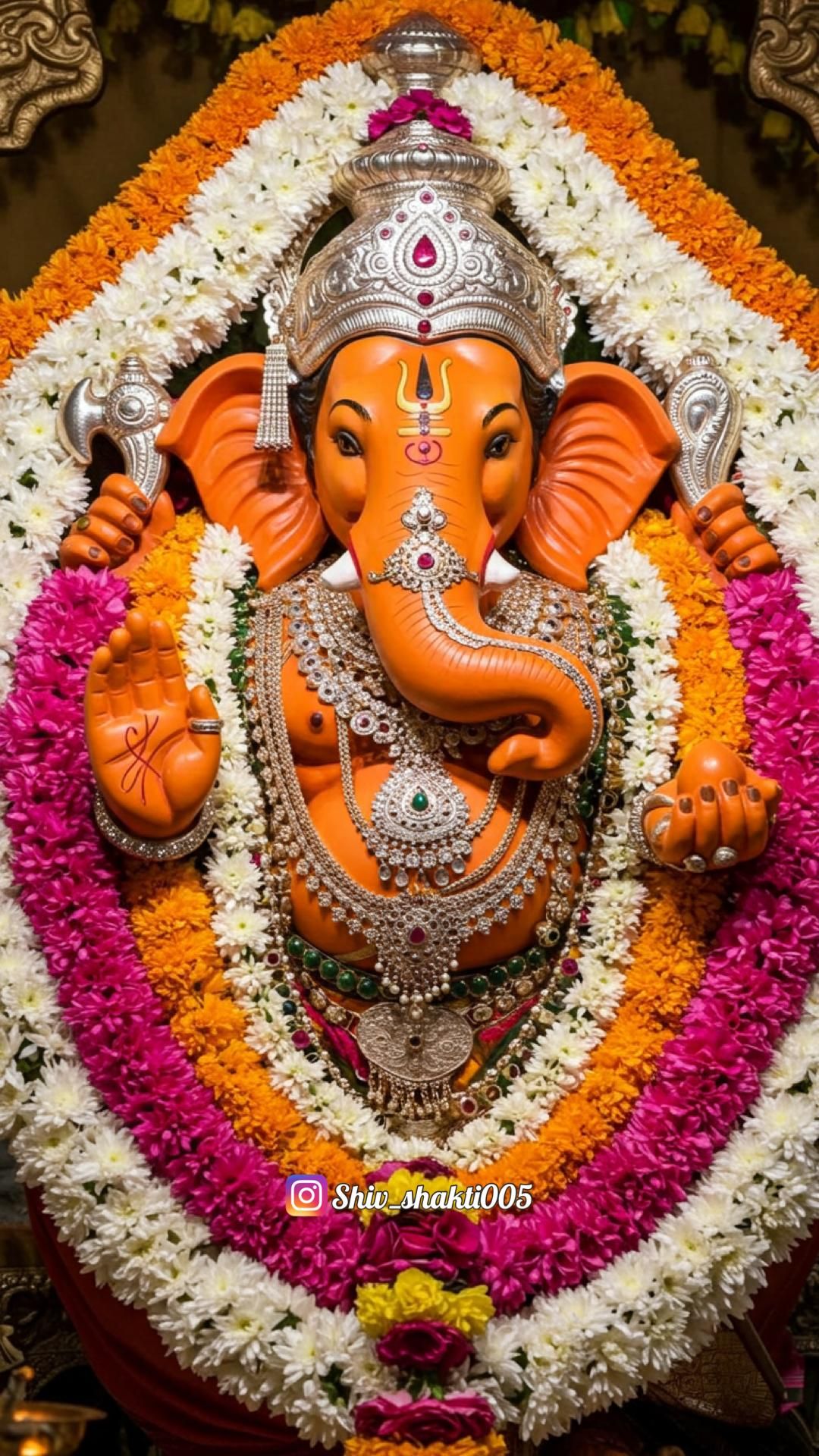 Ornate Ganesha with floral backdrop