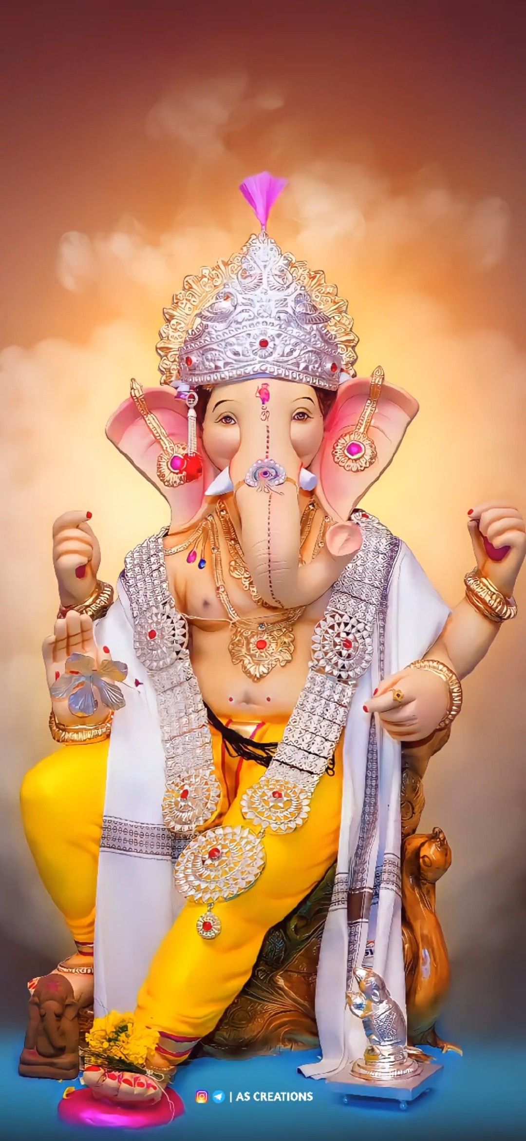 Lord Ganesha with floral headgear