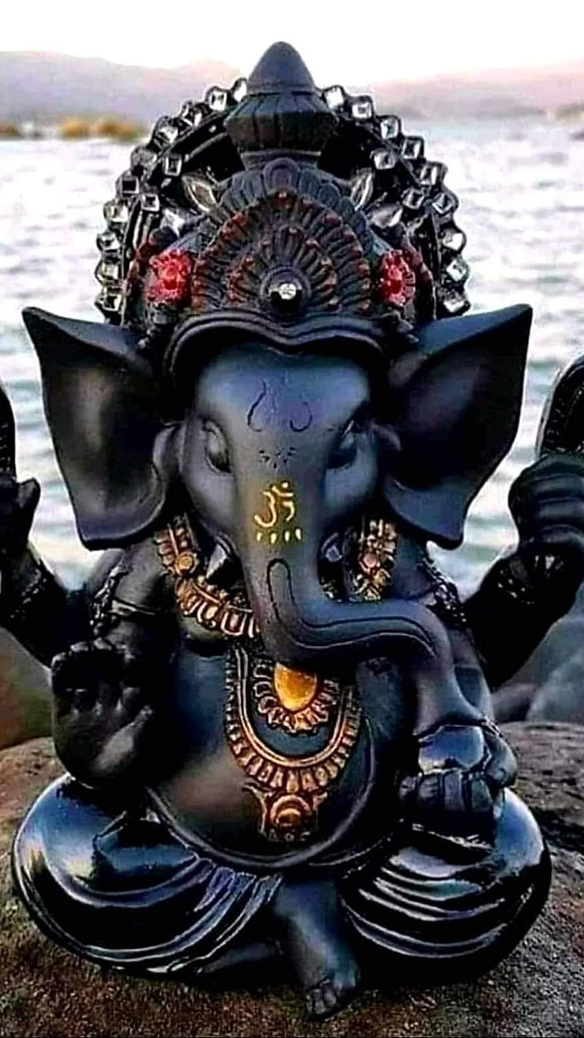 Ganesha statue on a serene beach