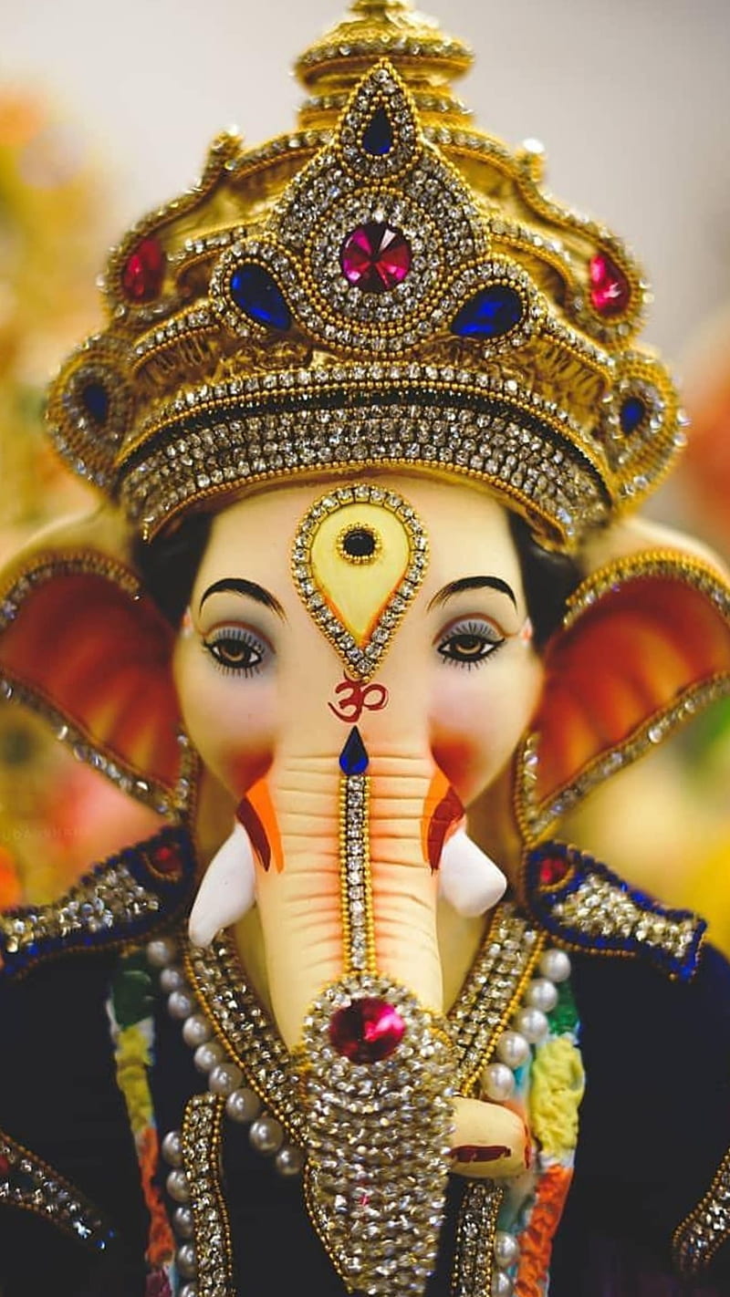 Close-up of a jeweled Ganesha idol.