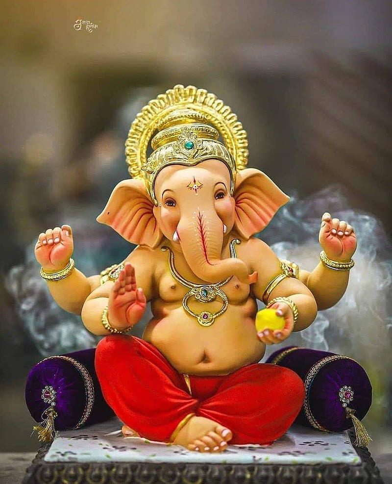 Lord Ganesha bestows blessings upon devotees.