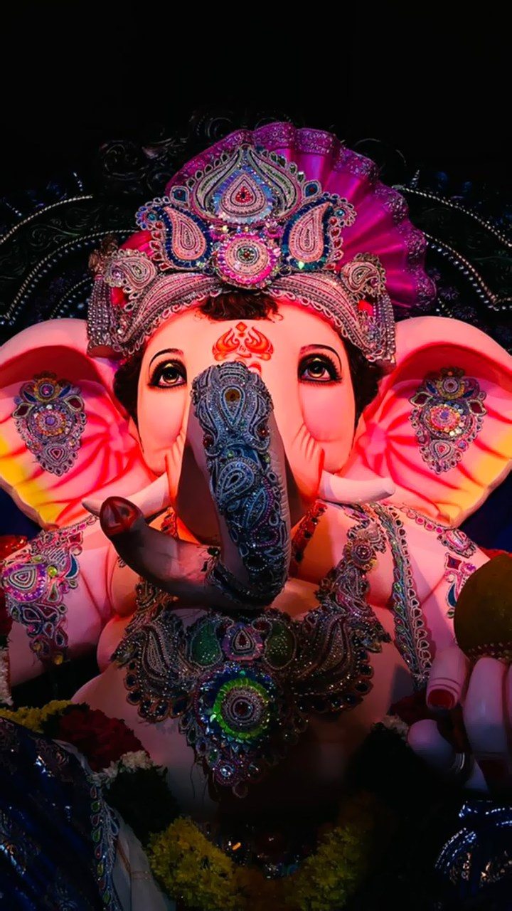 Colorful Ganesha face with floral garlands