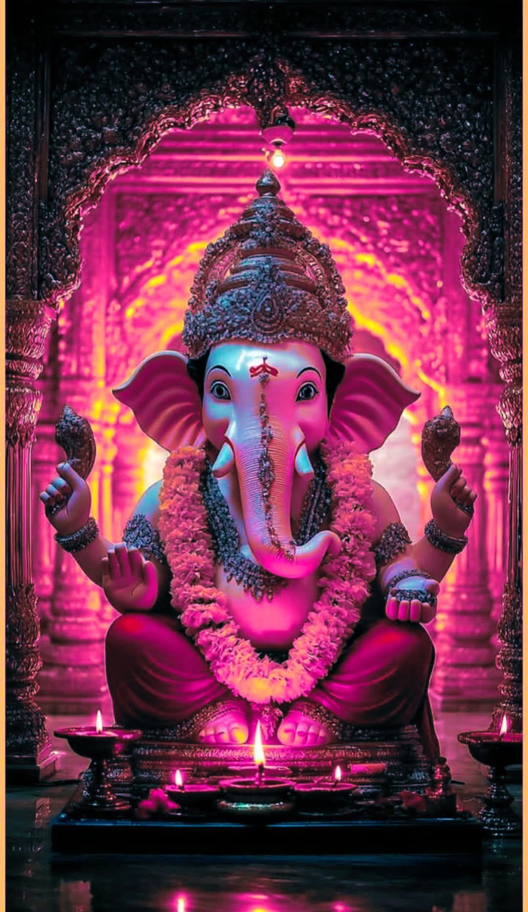 Radiant Ganesha idol in pink lighting