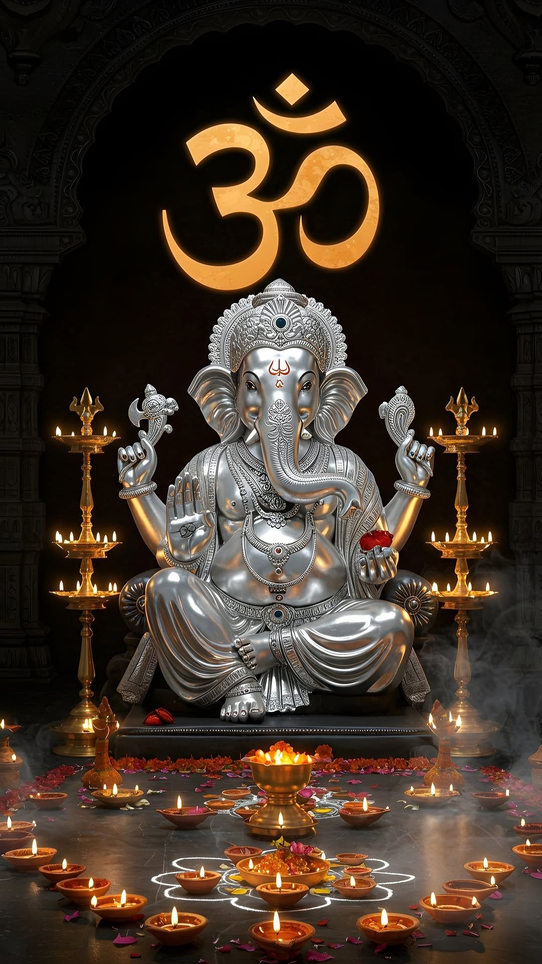 Silver Ganesha statue with Om symbol