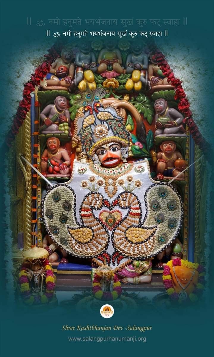 Hanumanji adorned with flowers and feathers.