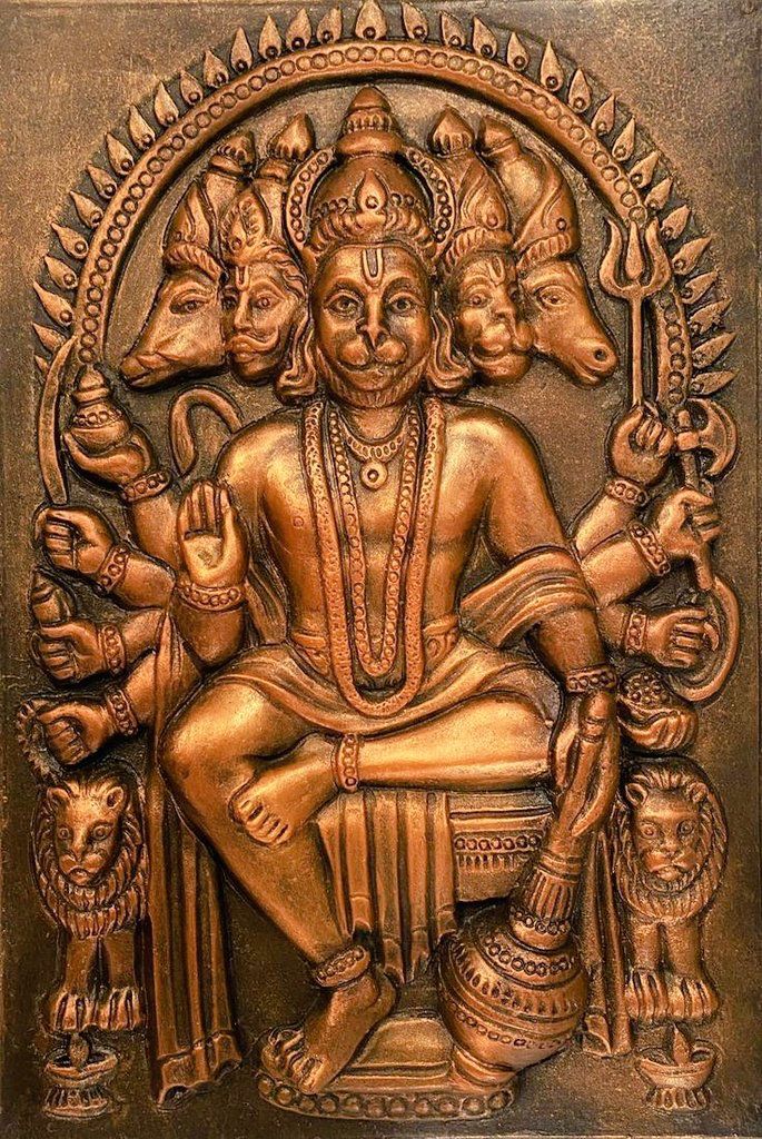 Multi-headed Hanuman divine copper sculpture.