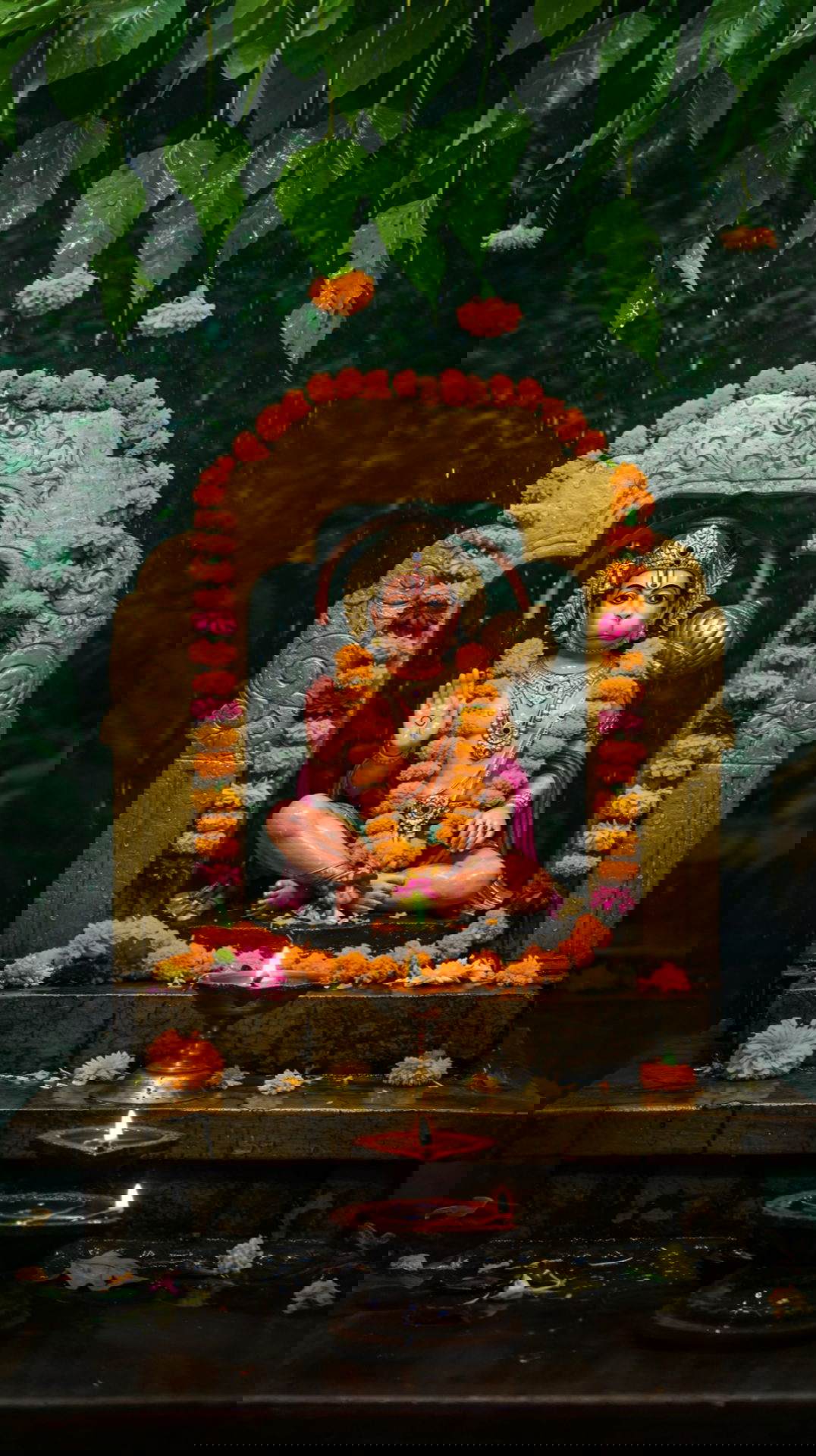 Hanumanji seated amidst lush greenery