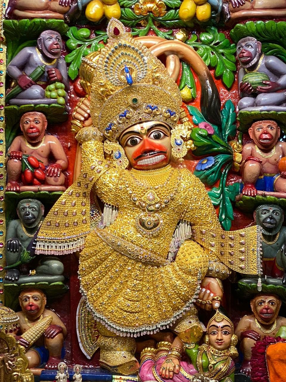 Golden Hanuman statue radiating divine energy