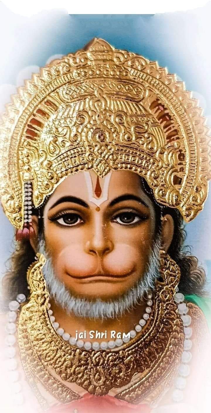 Golden Hanuman portrait with halo.