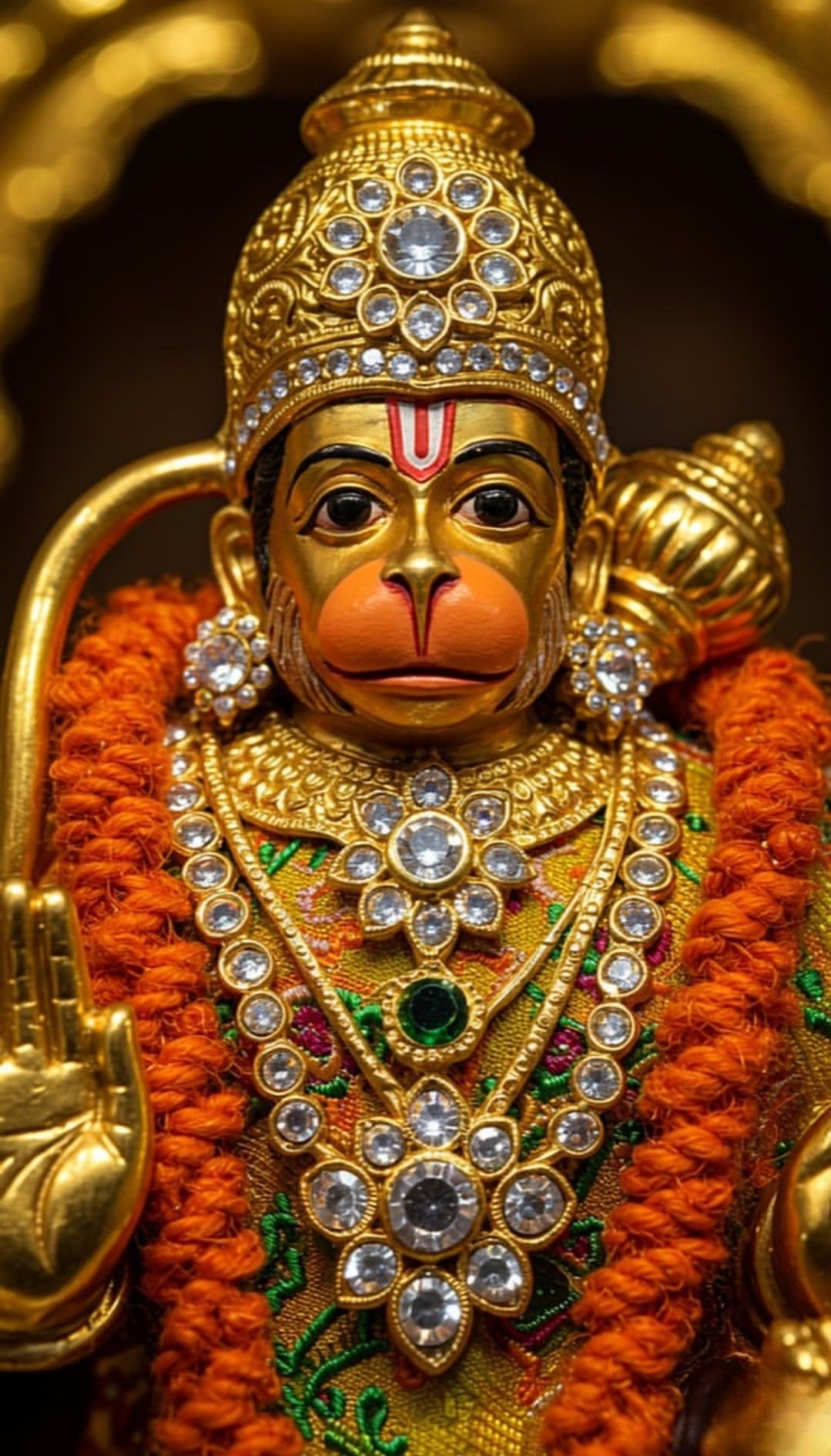 Golden Hanuman with jeweled adornments