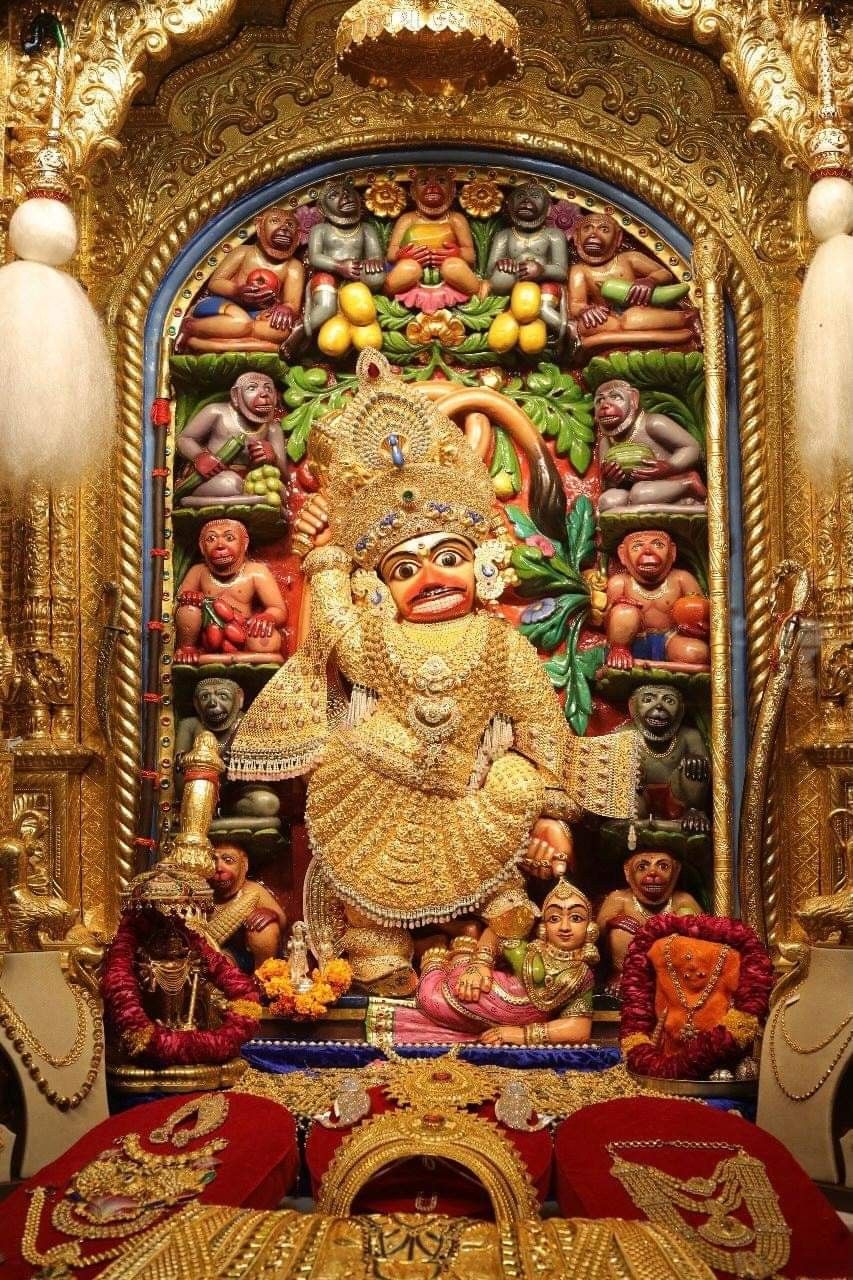 Golden Hanuman idol in ornate temple