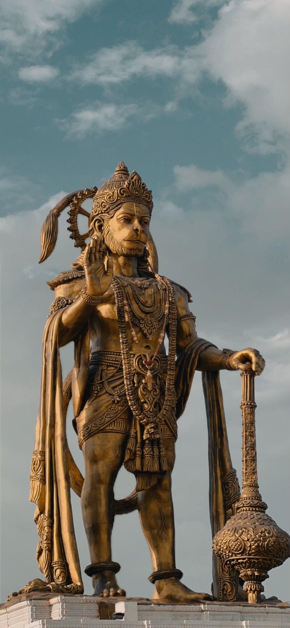 Golden Hanuman statue in sunlight