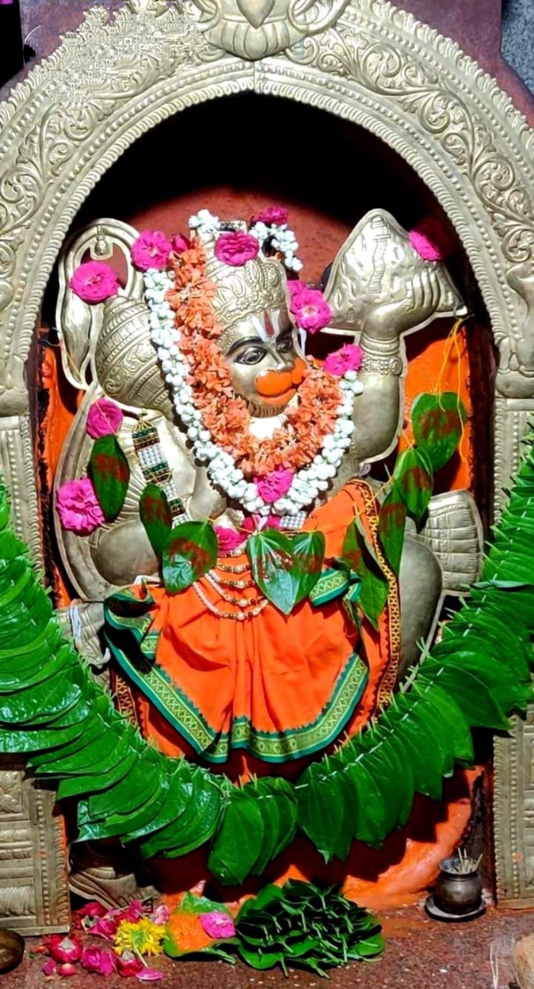 Hanuman adorned with flowers devotional image