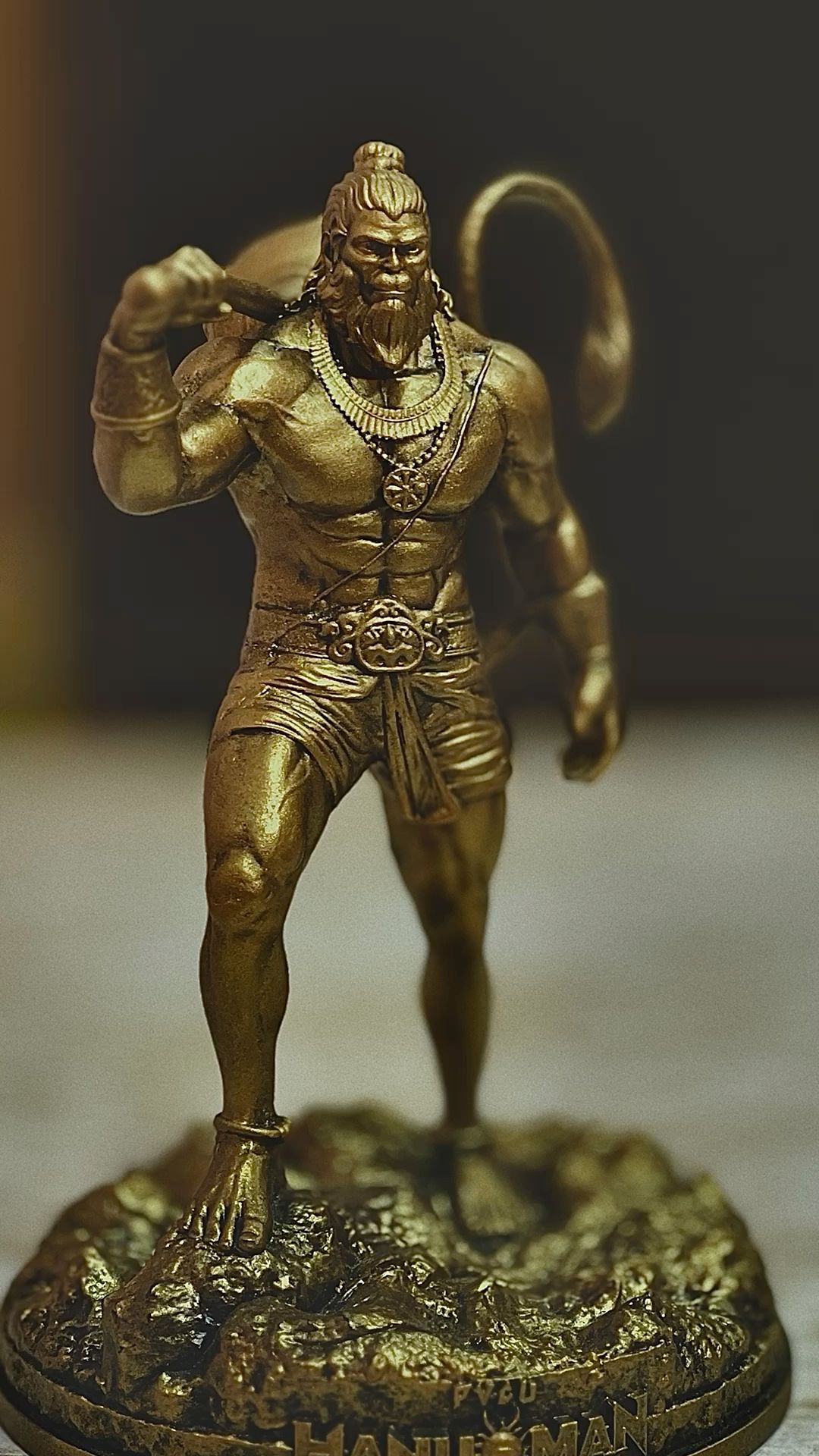 Golden Hanuman statue radiating devotion