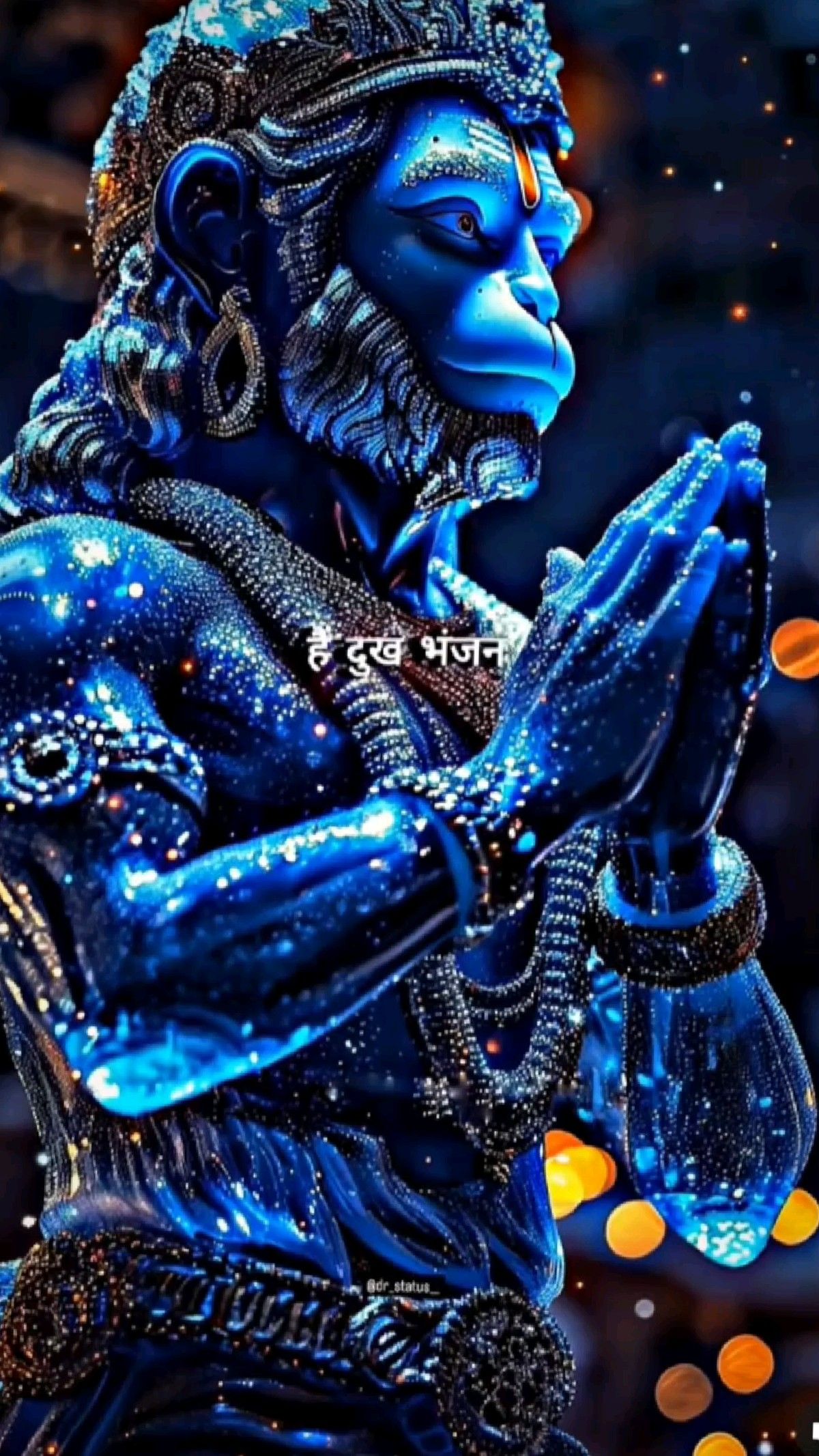 Blue Hanuman in prayerful pose.