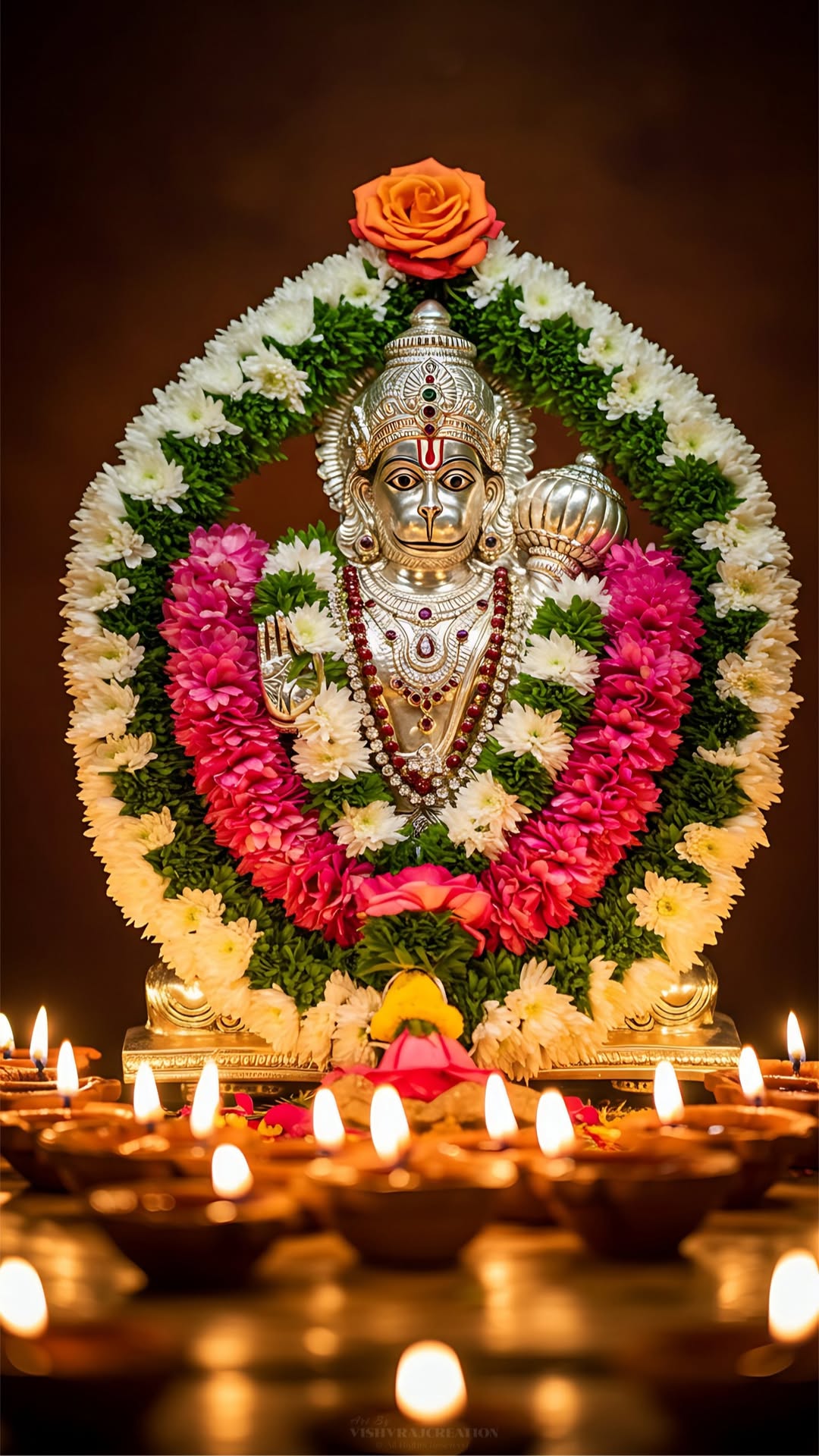 Hanuman adorned with floral garland