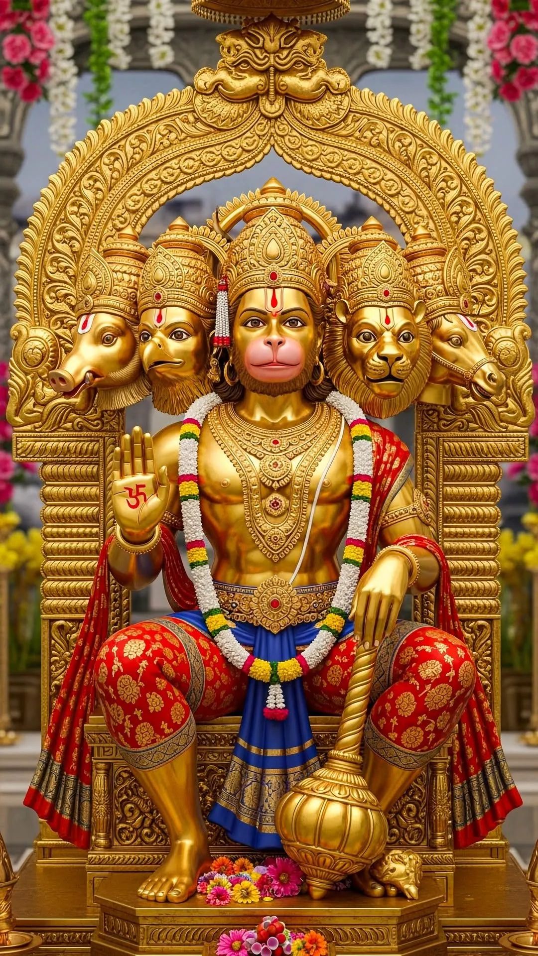 Triple-headed Hanuman statue with golden glow.
