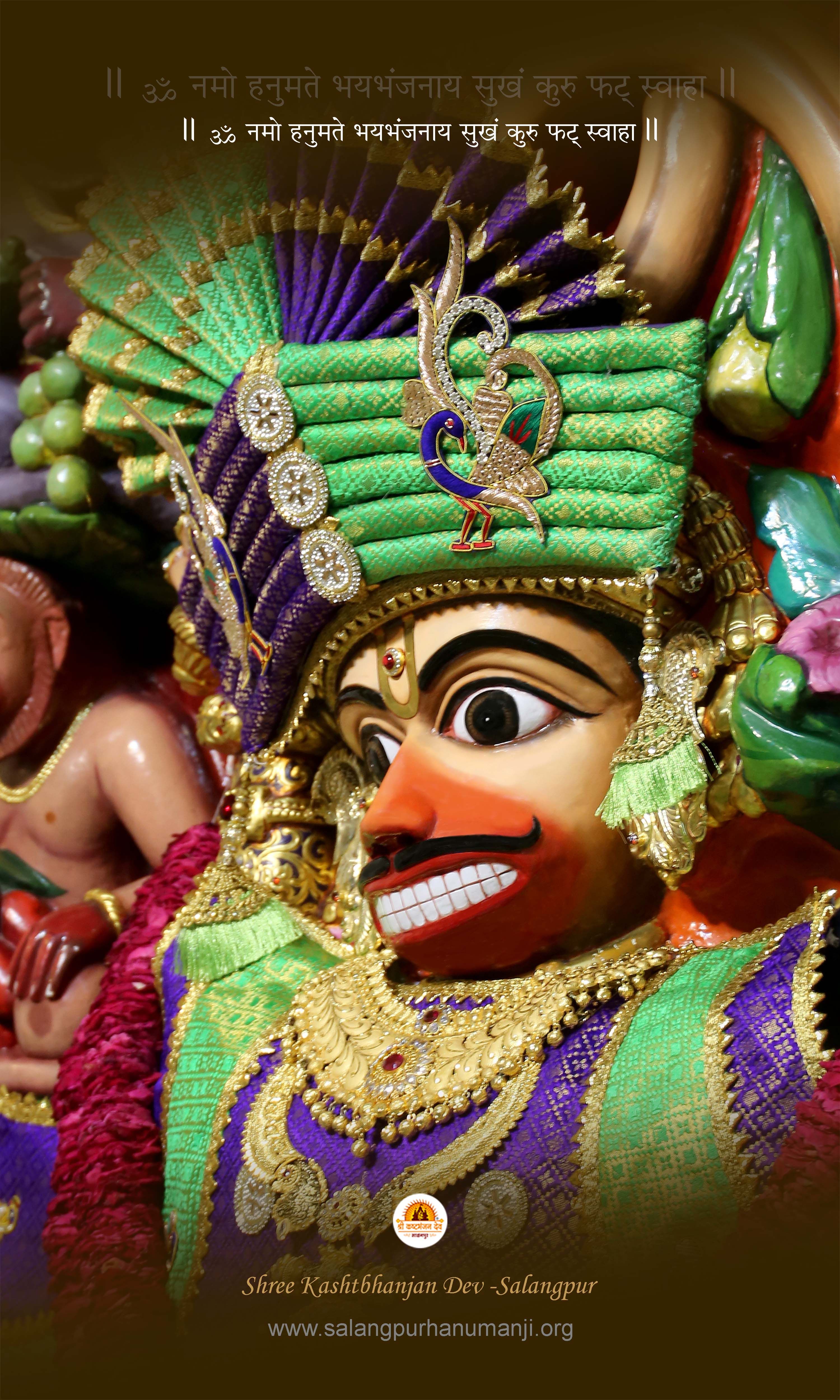 Hanumanji adorned with flowers and gold.