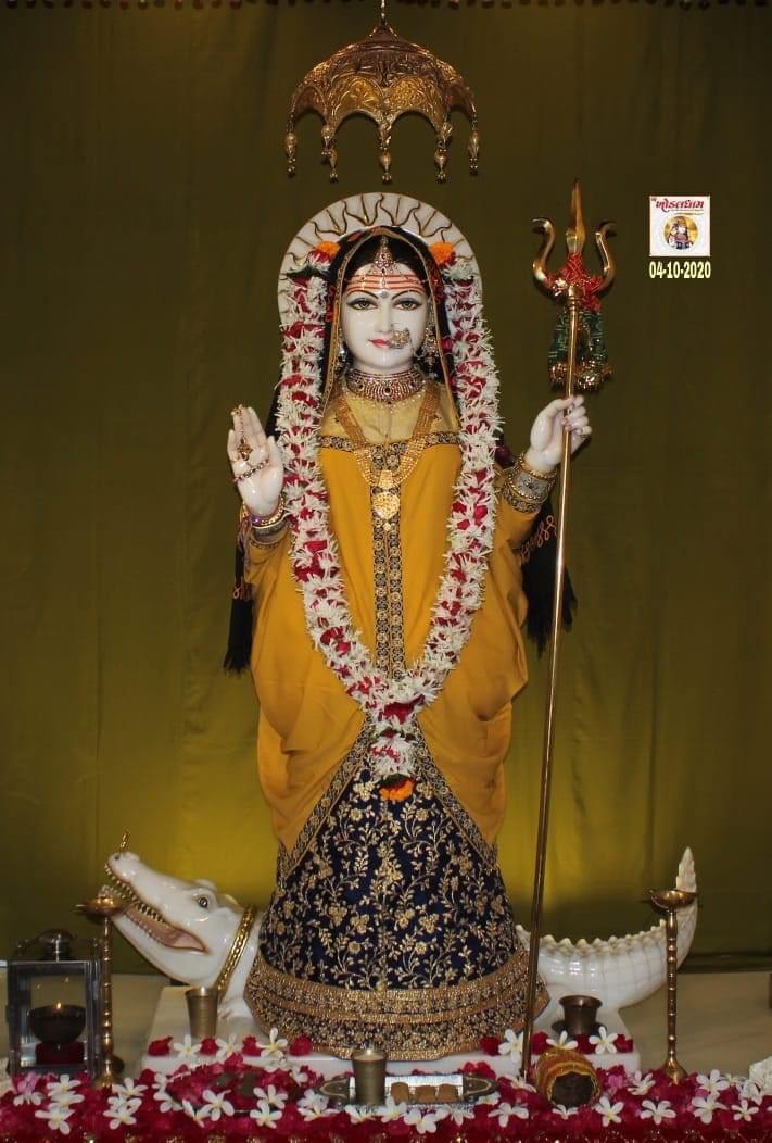 Khodiyar Maa in yellow sari statue