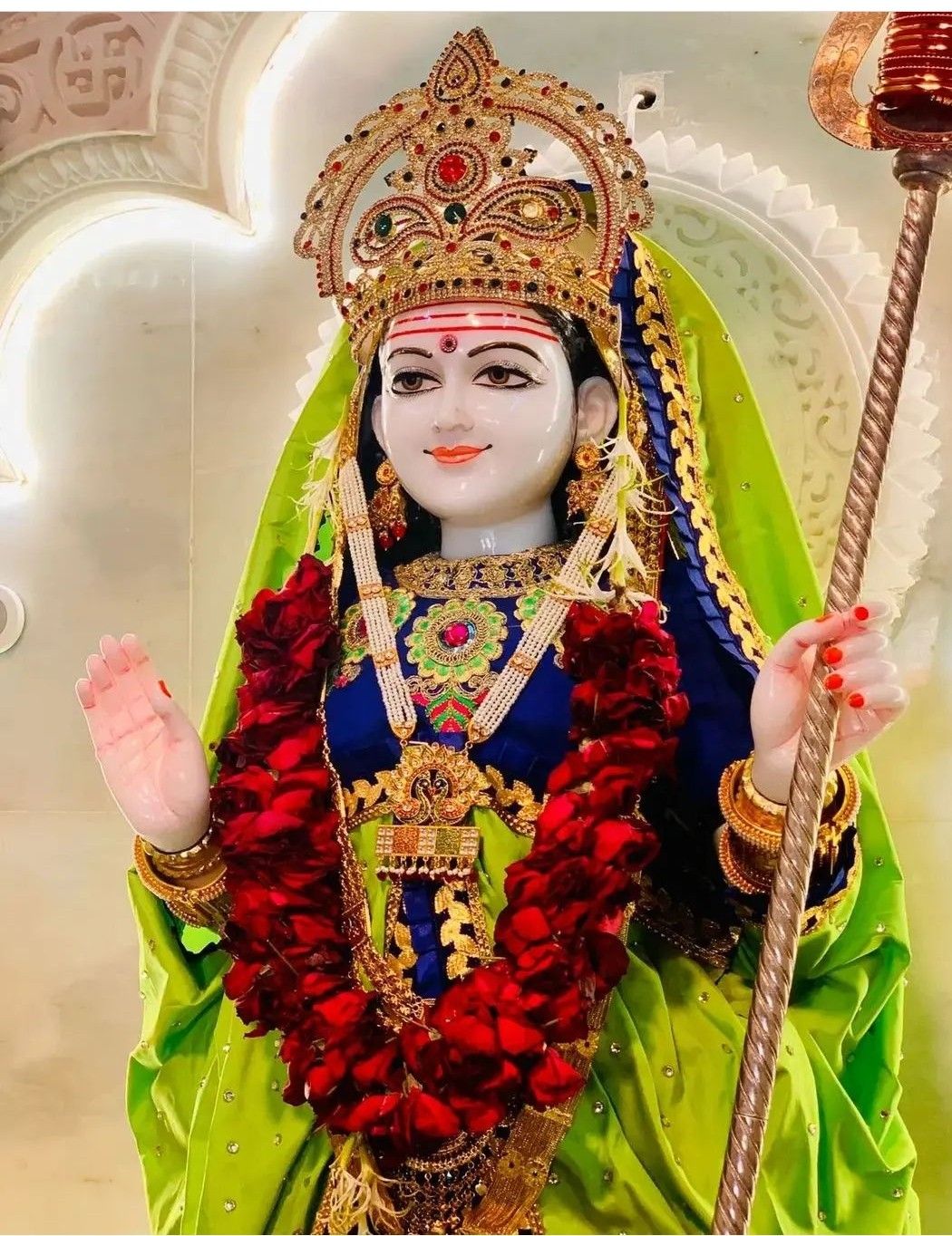 Khodiyar Maa statue with floral adornments