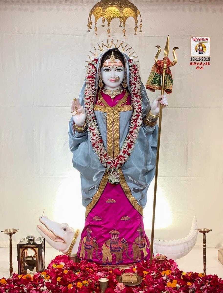 Khodiyar Maa idol with flowers and halo