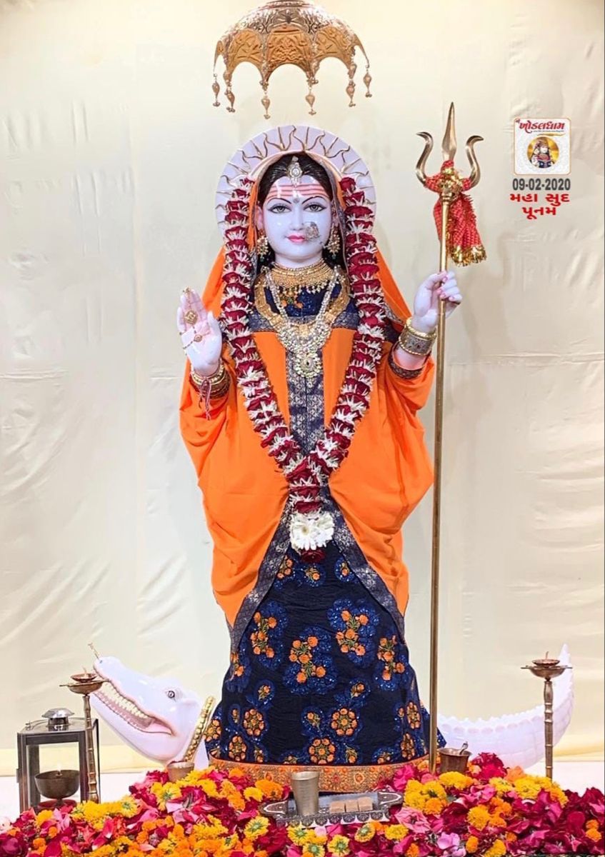 Khodiyar Maa statue with trident and flowers