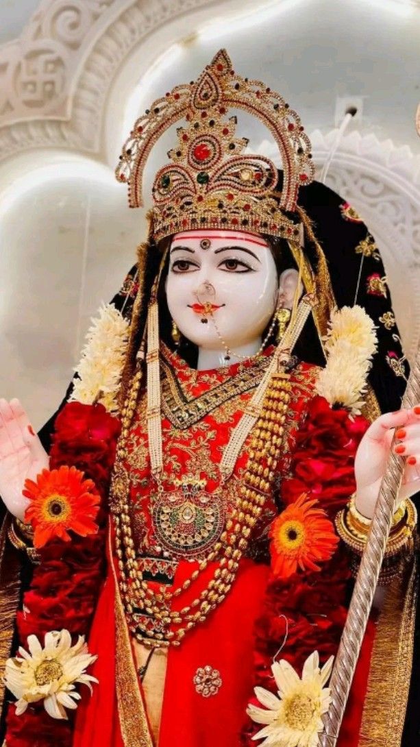 Khodiyar Maa with floral decorations.