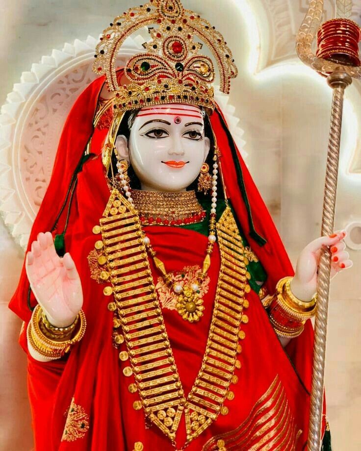 Khodiyar Maa statue with golden jewelry.