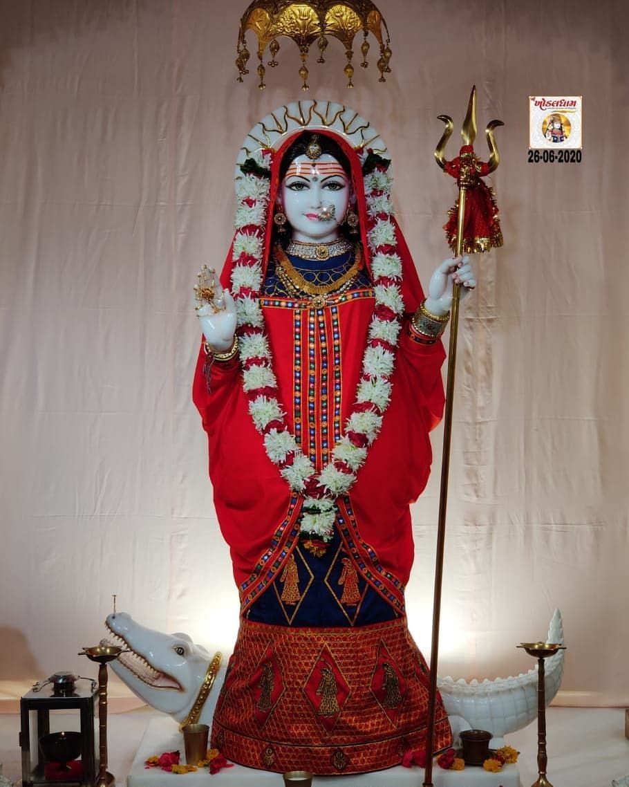 Khodiyar Maa in red sari with trident