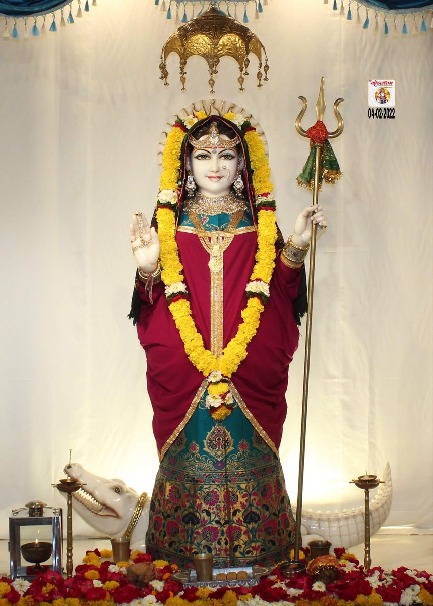 Khodiyar Maa statue with trident and flowers