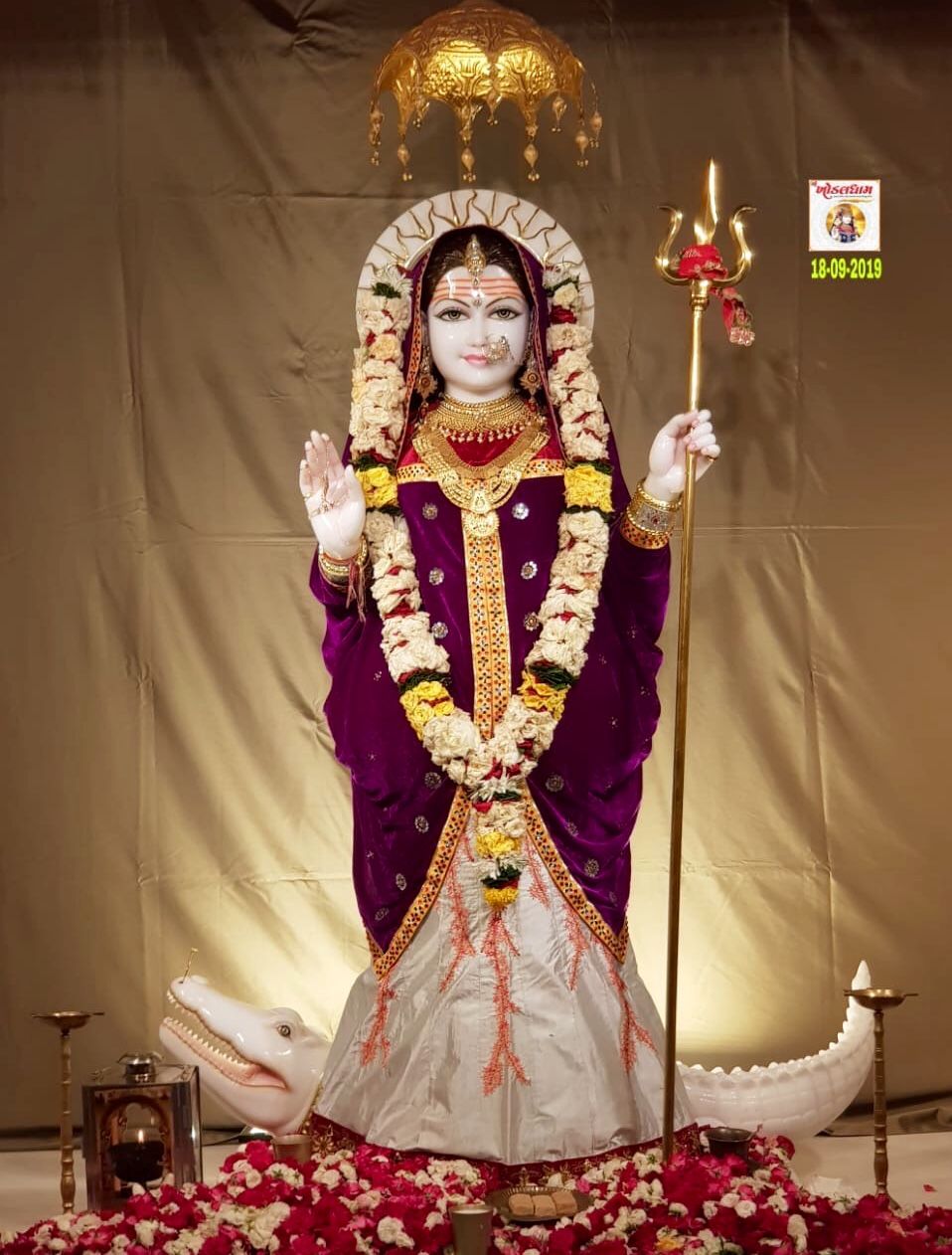 Khodiyar Maa with trident and flowers