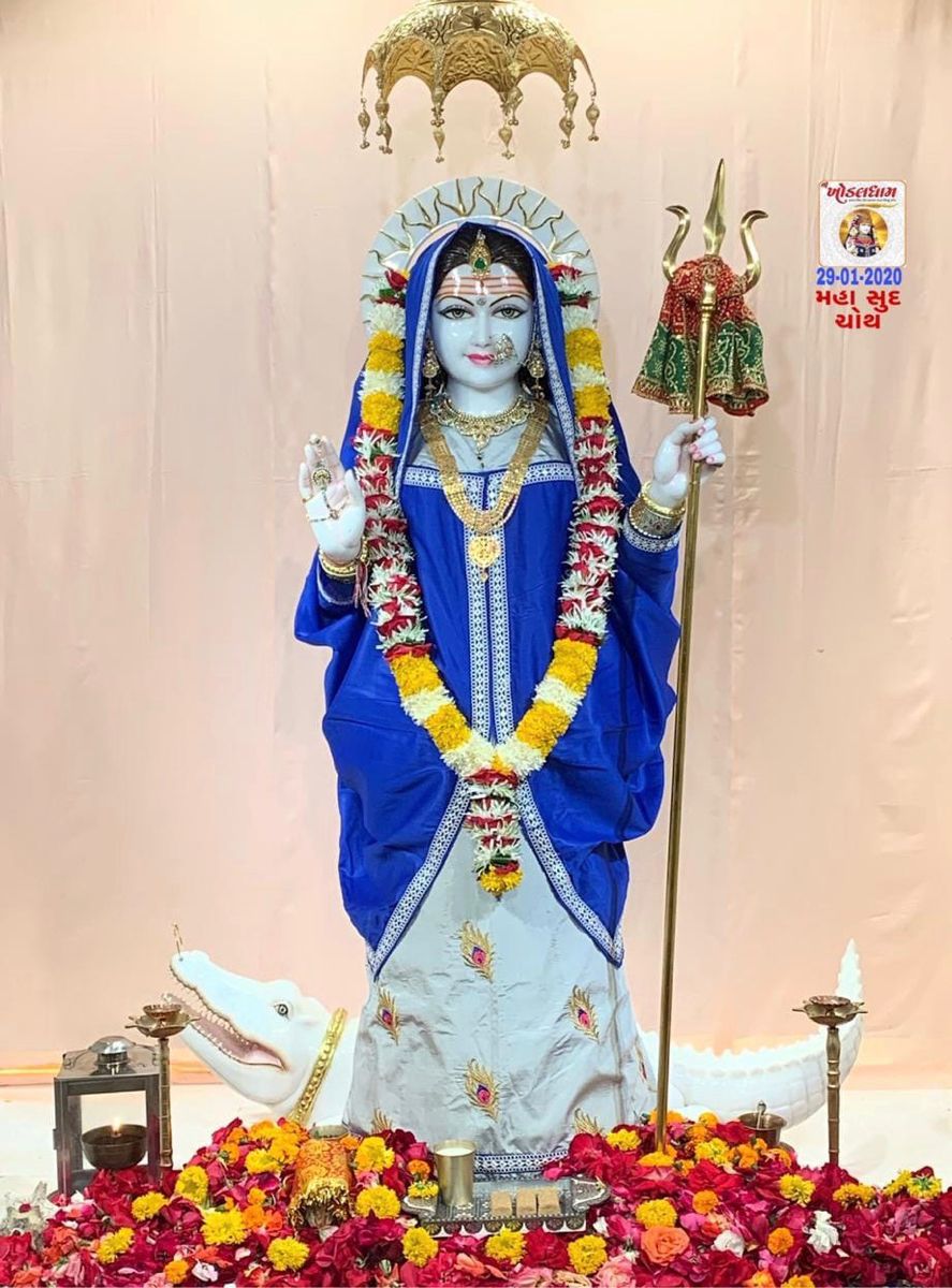 Khodiyar Maa standing with trident and flowers
