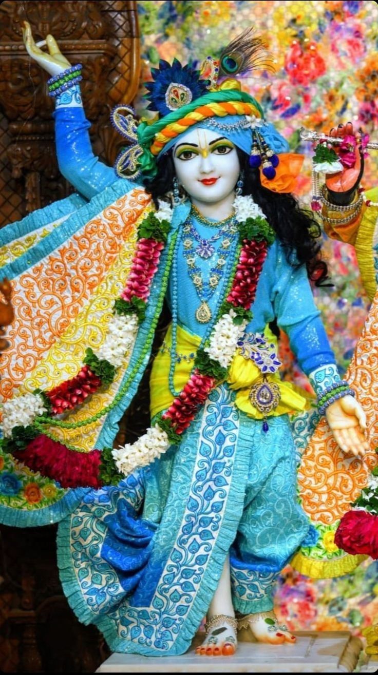 Krishna playing flute with peacock feather