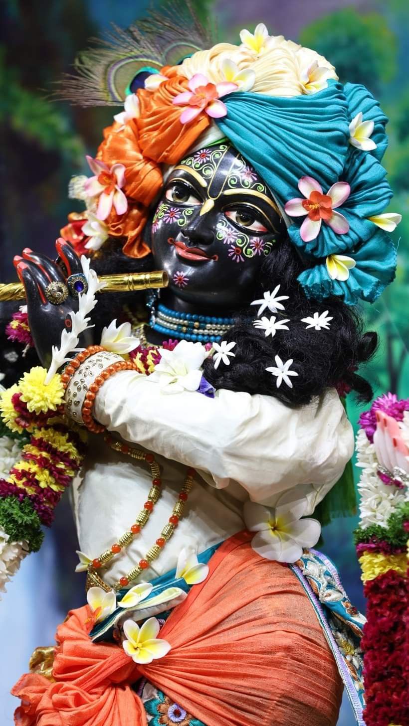 Krishna playing flute with flowers