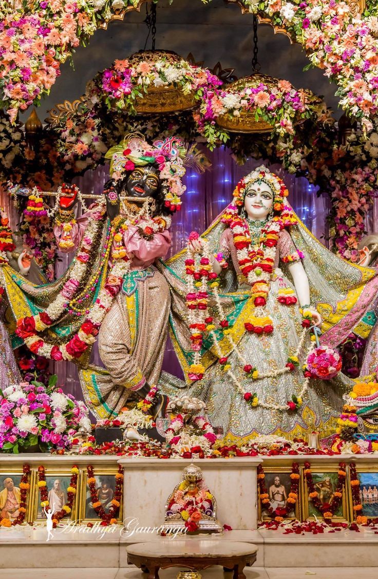 Krishna and Radha amidst floral decorations