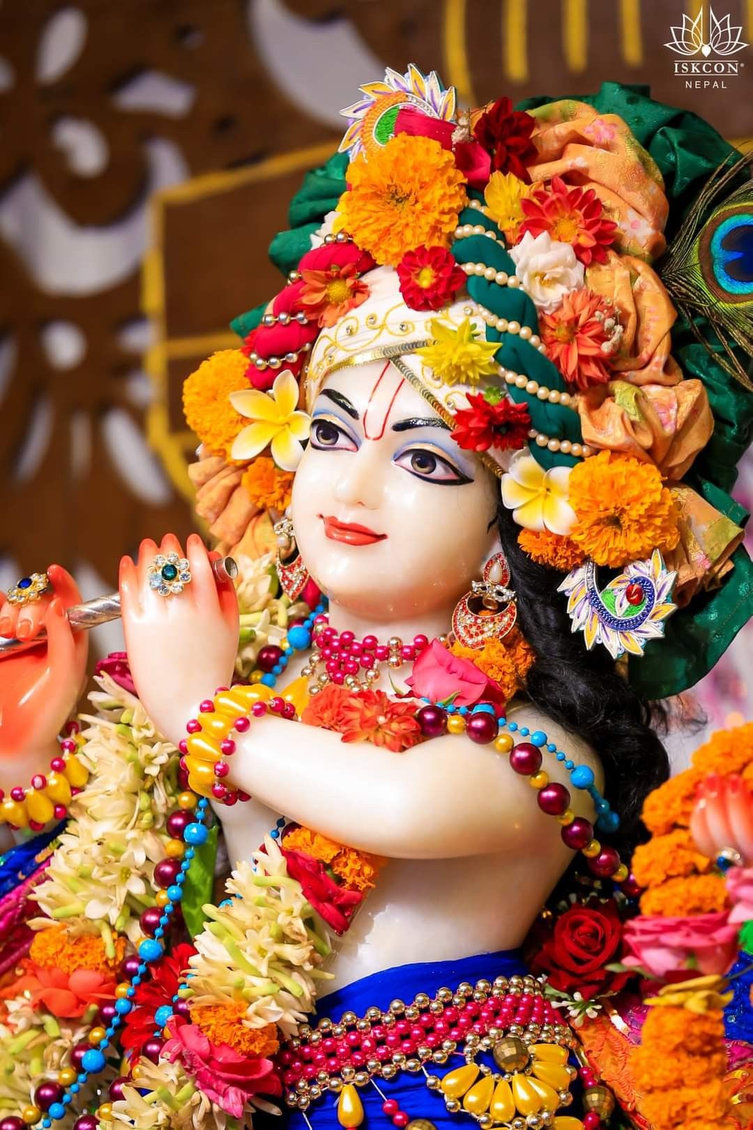 Lord Krishna with flute and flowers